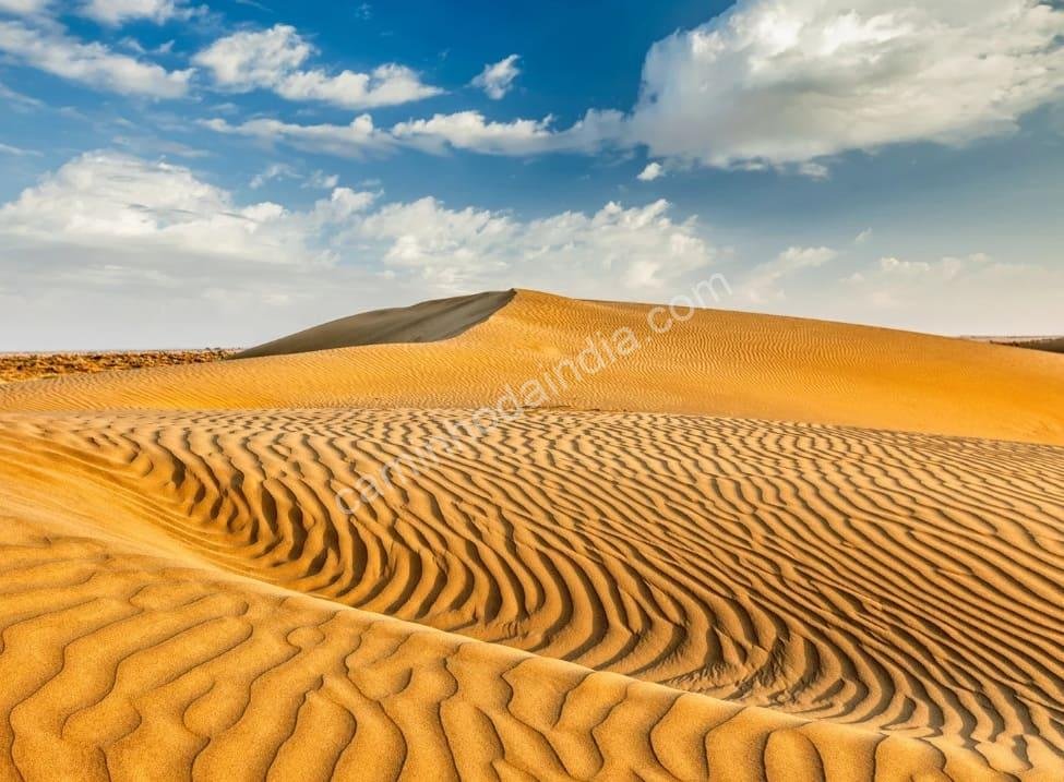 deserto-rajasthani-belo O magnífico deserto de Rajasthan revela sua beleza dourada sob o pôr do sol, um símbolo da serenidade e grandiosidade do estado indiano